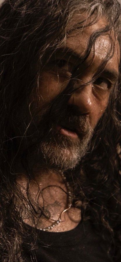 Blackbeard, wet and disheveled. 