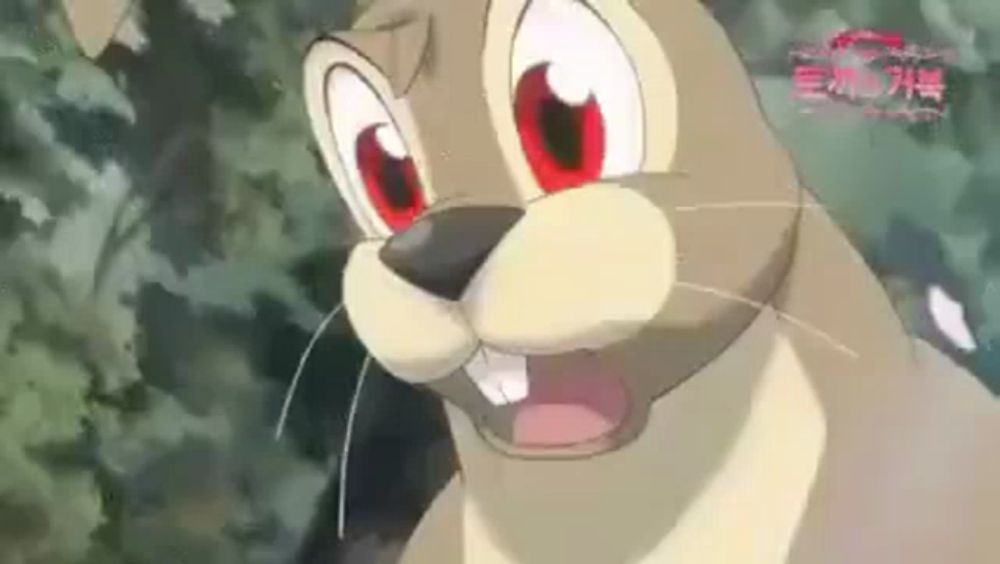 a close up of a cartoon rabbit with red eyes and a big mouth .