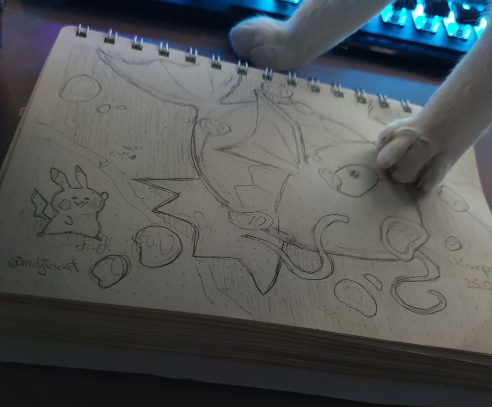 I sketched from a pokemon card magikarp and my cat wants attention. There's also a little pikachu in the left corner waving 