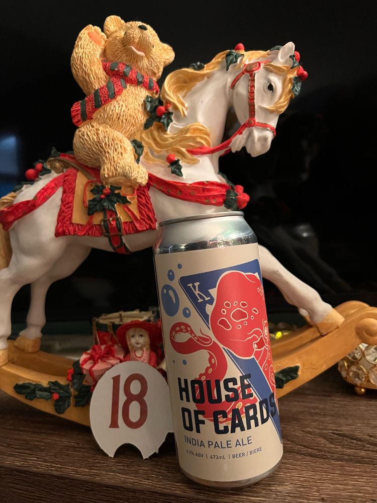 A can of beer with Christmas decorations. 