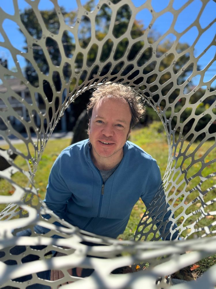 Nervous_Jesse featured inside of Corollaria monolith an aluminum sculpture she created that undulates with morphing hexagonal patterns