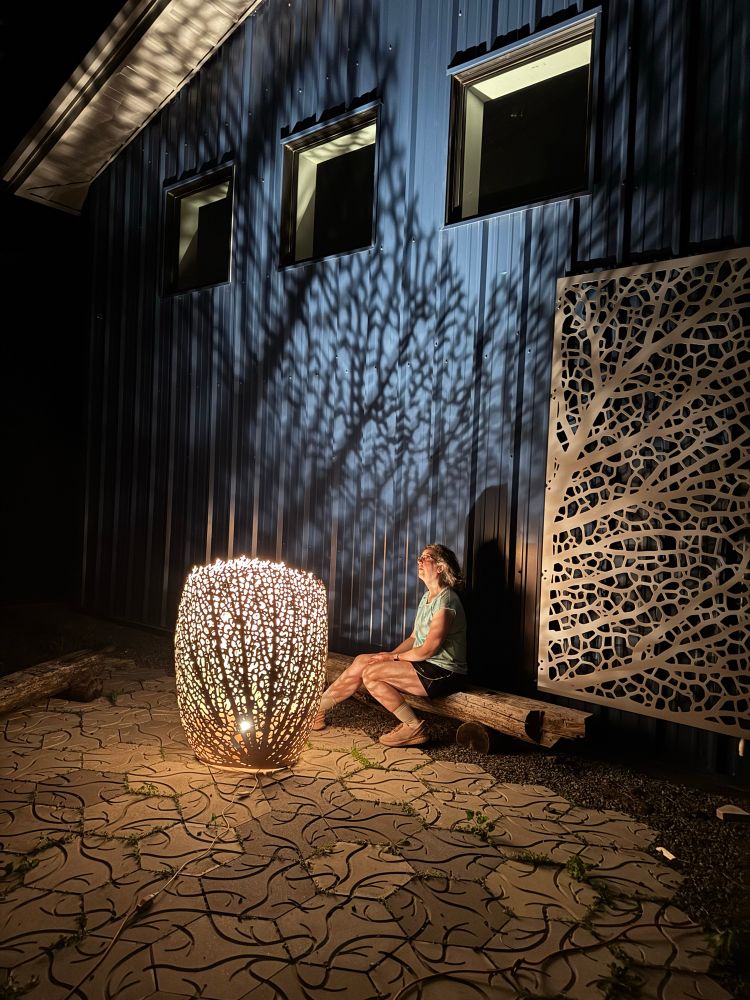 I’m sitting next to a 4 foot tall Hyphae lamp outside in the night with tree like shadows cast all around 