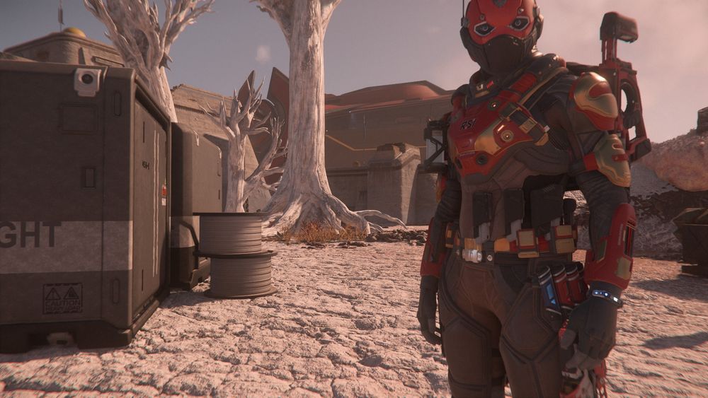 Standing in a Monox outpost, TekkerTen regards the camera from inside his festive New Year armor.