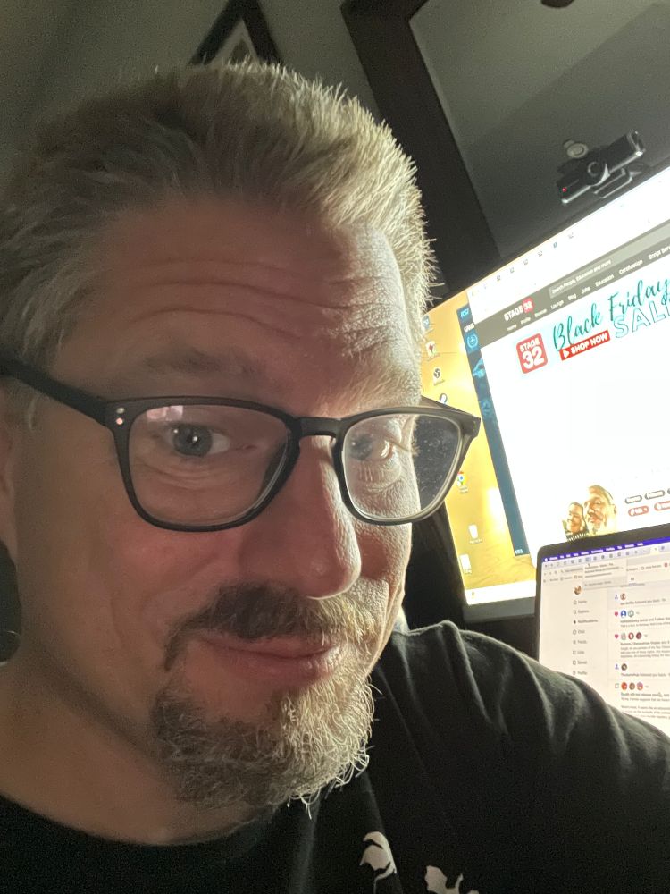 Sitting in the dark of the early morning, Tennyson E. Stead tackles the morning routine in front of his computer.