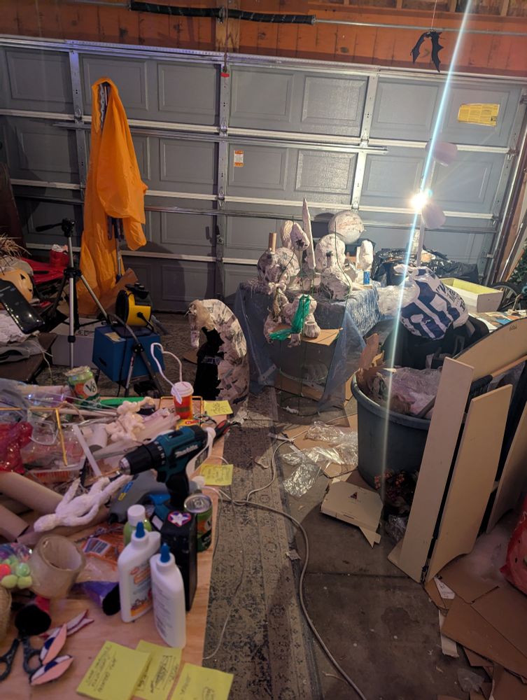 a garage full of tools and drying paper mache 