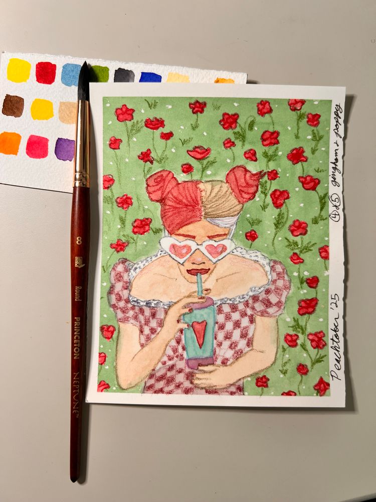 A white woman in heart sunglasses and a gingham top reclining in a field of red poppies with a beverage. 