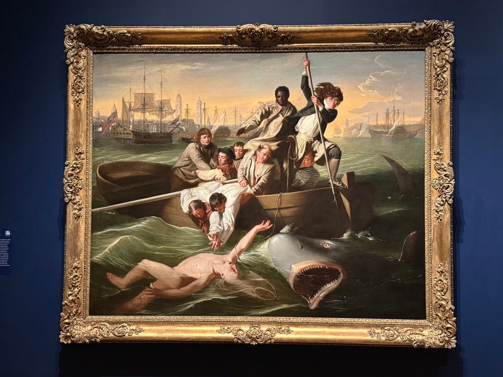 Dramatic painting of people in small boat trying desperately to pull their inexplicably naked friend from the jaws of a Great White Shark who has clearly had some lip work done.
