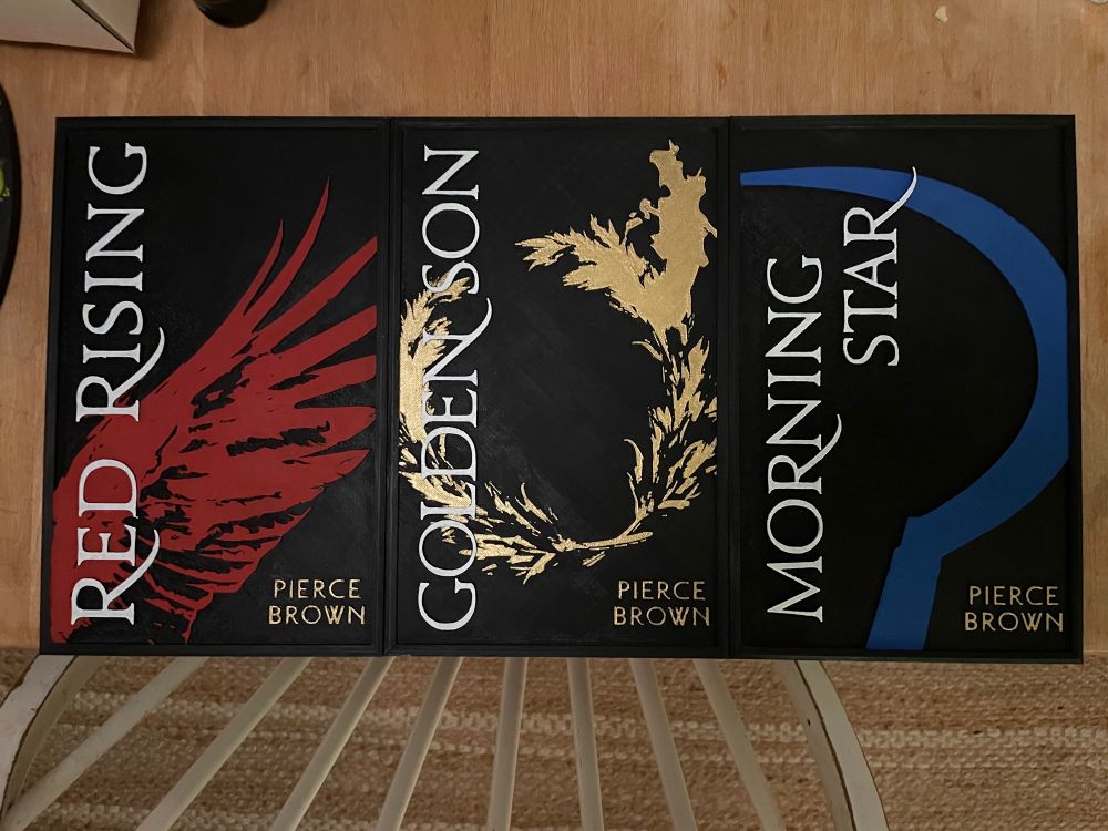 3D printed covers of the original Red Rising trilogy, hand painted for a client