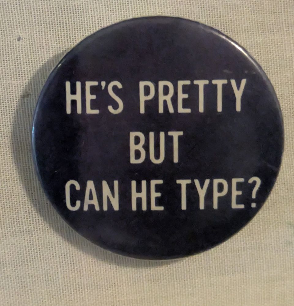 A blue button that says in white text, he's pretty but can he type?