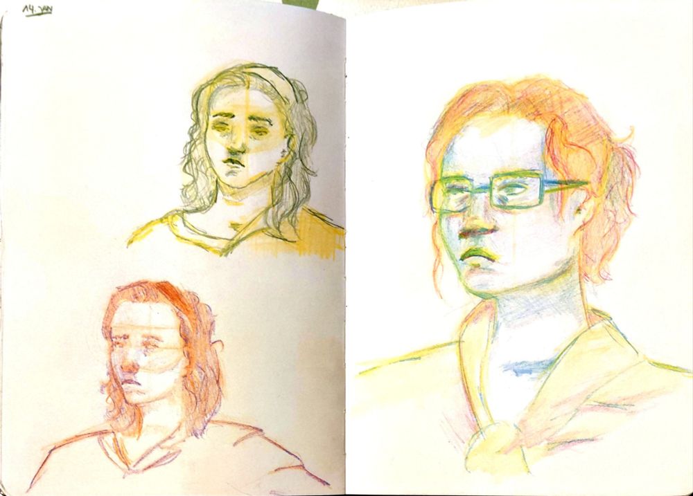 Sketchbook with 3 drawings of a woman's face/portrait in colored pencil.
On the left page, there are 2 tiny sketches. The top sketch is made with yellow and green pencils. The bottom sketch is made with orange and purple.
On the right page, there's a larger, full page drawing with yellow, blue and red pencils. 