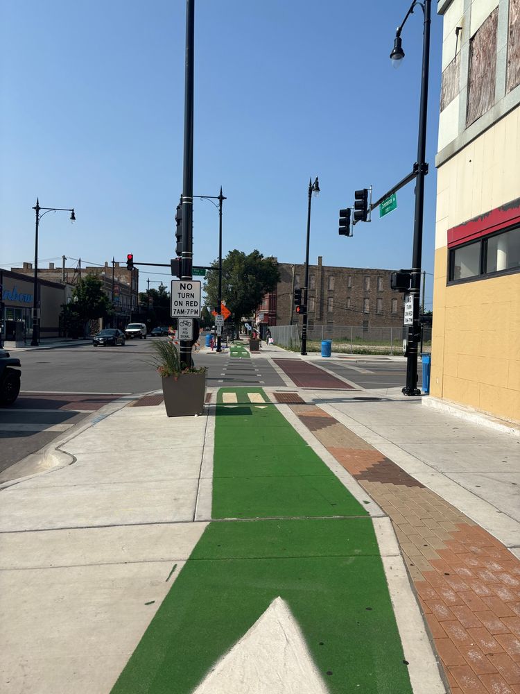 Green bike intersection for crossing with sidewalk signal