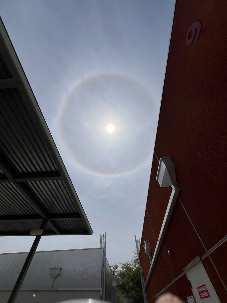 Solar halo between two roofs.