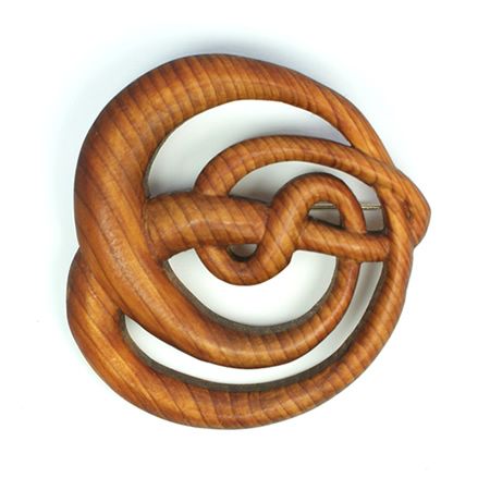 Brooch inspired by Charles Rennie Mackintosh style, hand carved from yew.