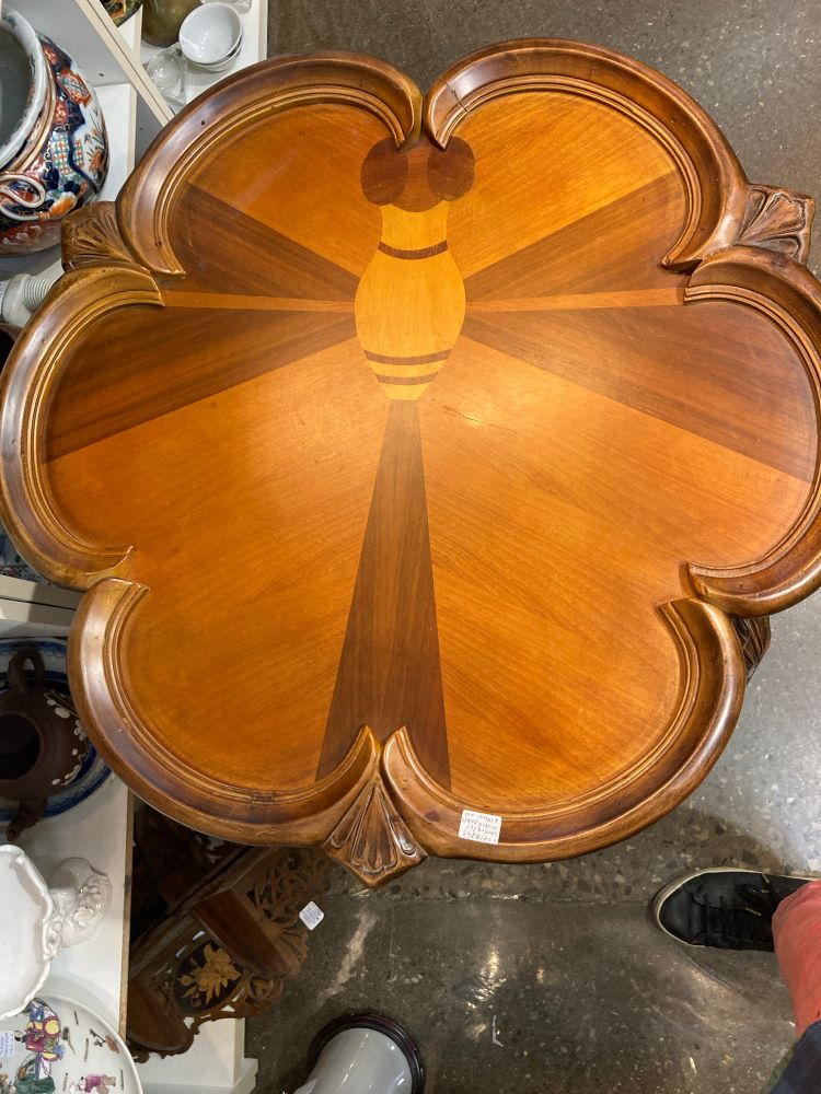 Top of table with inlaid geometric dragonfly design 