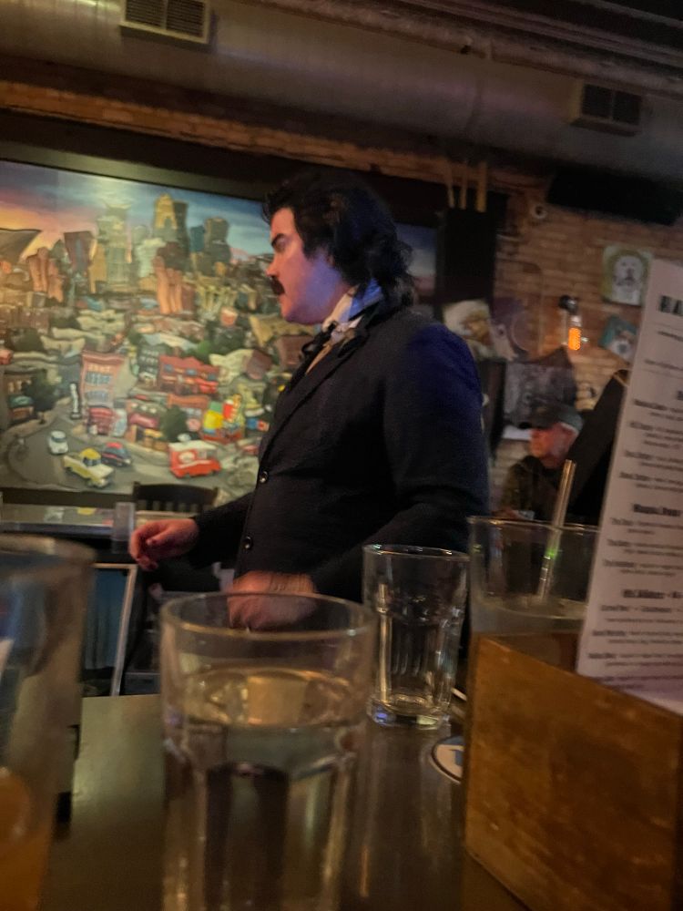 A person dressed as Edgar Allen Poe