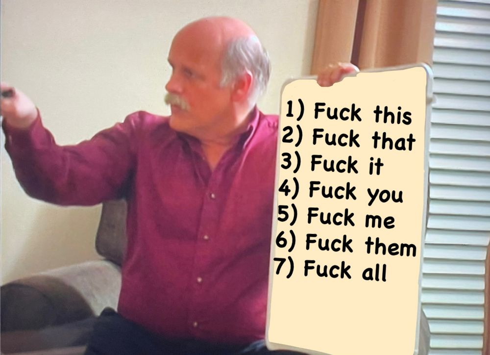 Jeff VanVonderen holding up a dry erase board that reads, “Fuck this, fuck that, fuck you, fuck me, etc.”  