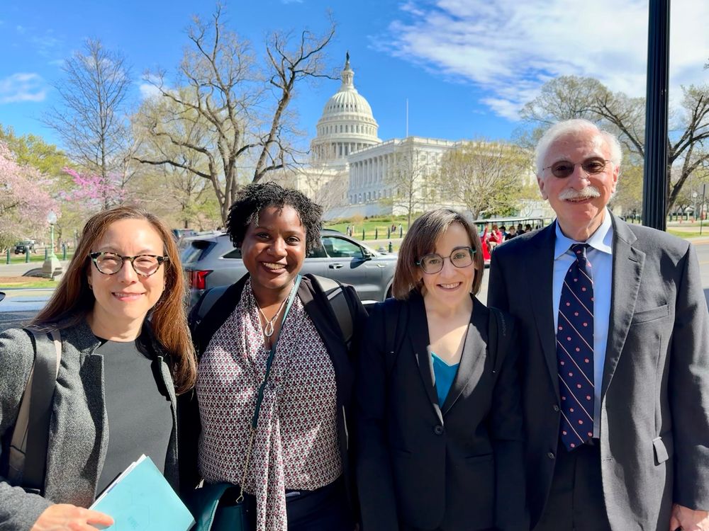 Photo of four UW BioE faculty with the Capitol in the background 