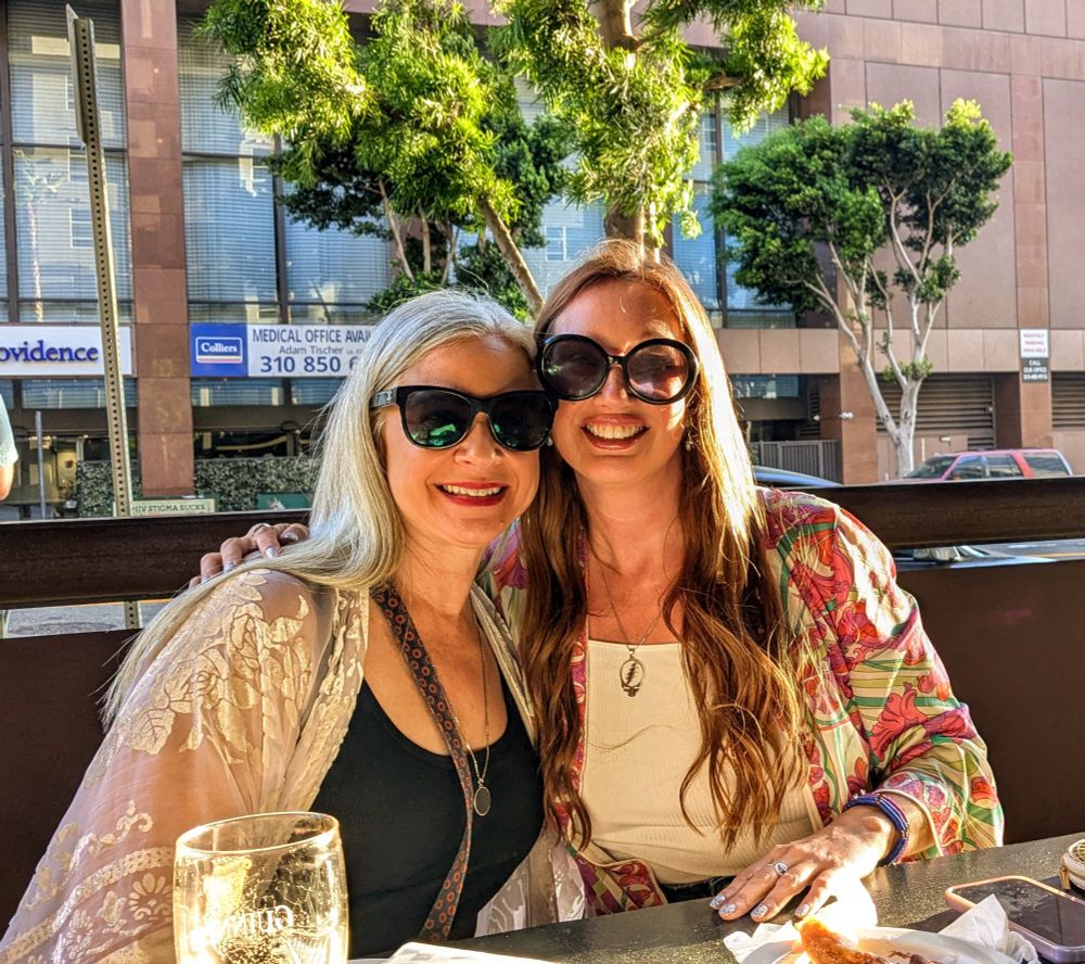 two women in a picture in golden hour sunlight