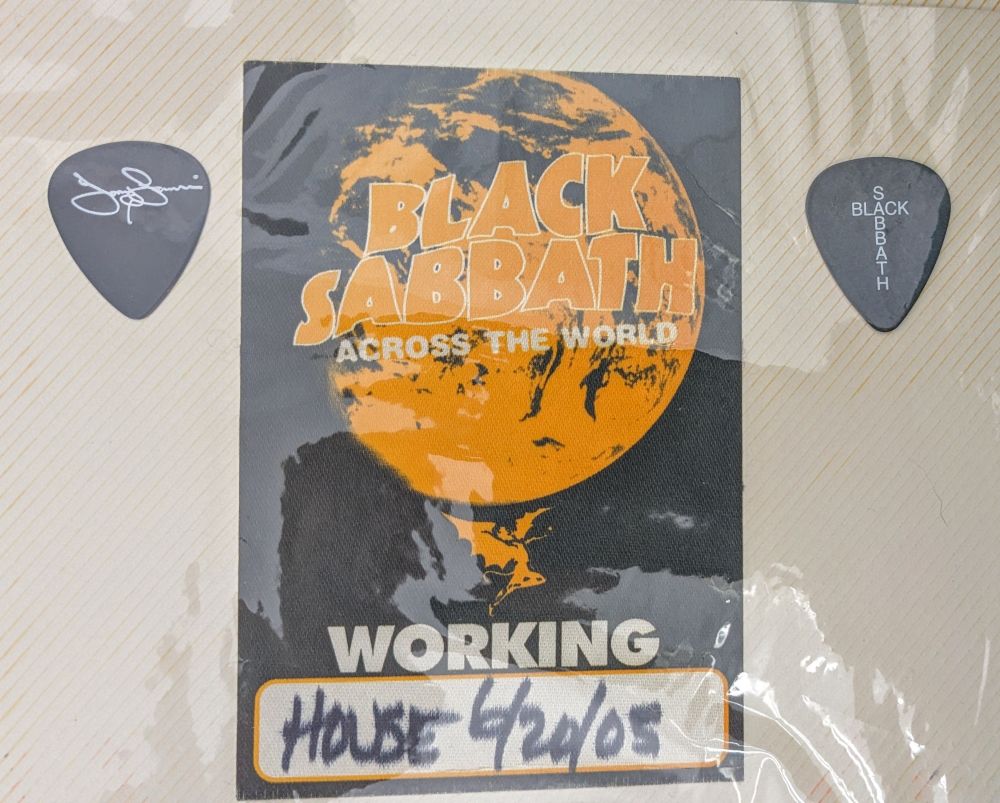 two guitar picks and a pass to black Sabbath tour in 2005
