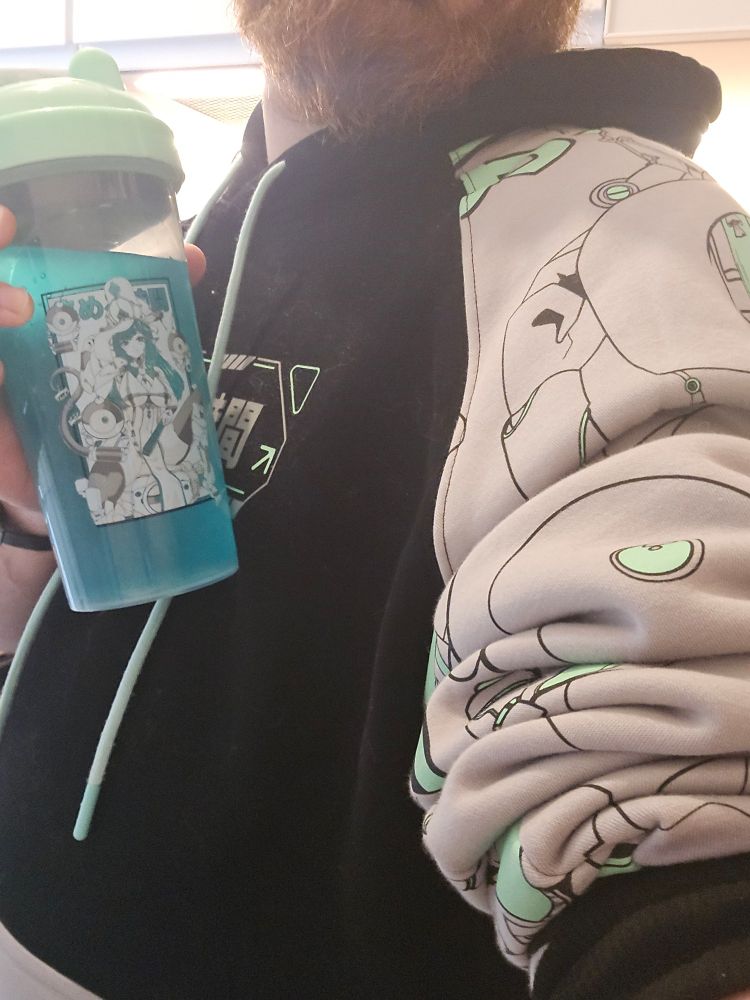 A selfie of Goru's chest, he is wearing the new gamersupps mecha sweatshirt and holding the new cup.

Also if you're reading ALTs i am sorry i don't post a lot i hope it's enough