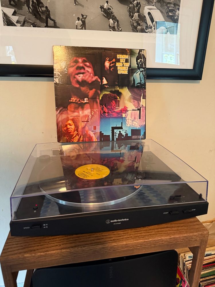 Record player with Sly and the Family Stone’s “Stand” perched on top. 