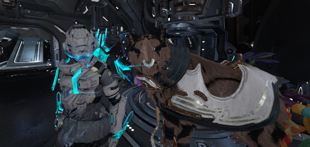 Warframe; my Operator standing by his enormous Kubrow.
