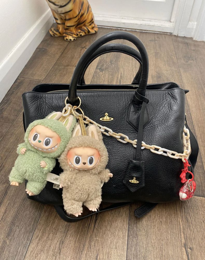 a picture of a bag with labubu keychains on it