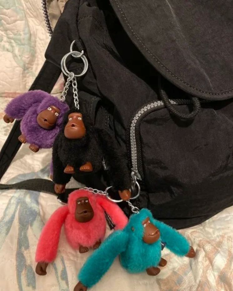 a picture of a bag with kipling gorilla keychains on it