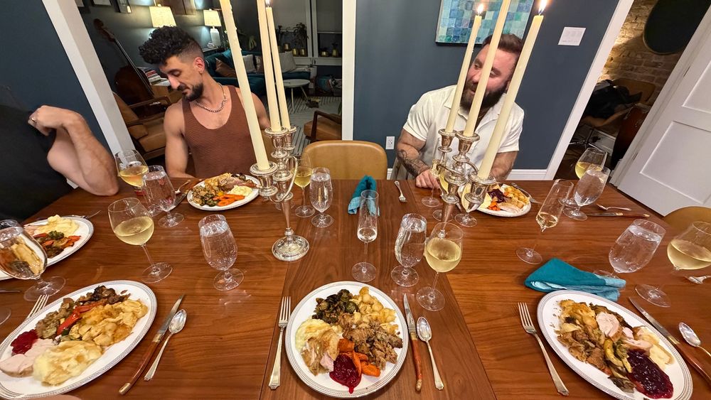 A thanksgiving table full of plates of food 