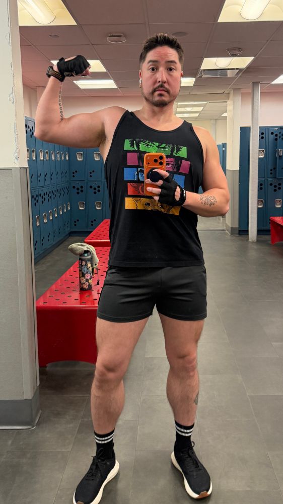 Selfie in the gym locker room mirror flexing my bicep 