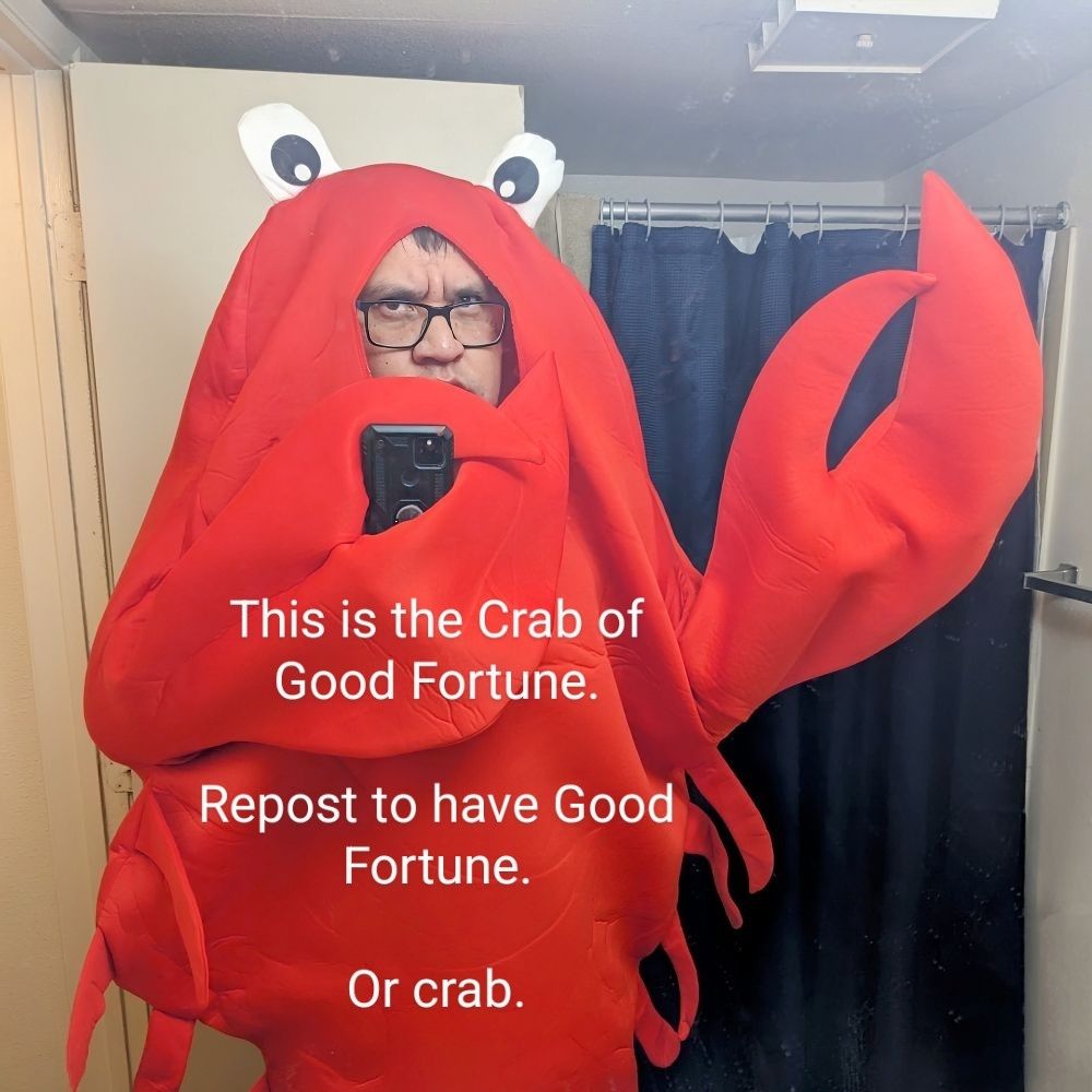 A person wearing a red crab costume and taking a selfie in front of a mirror.

This is the Crab of Good fortune 

Repost to have good fortune 

Or crab