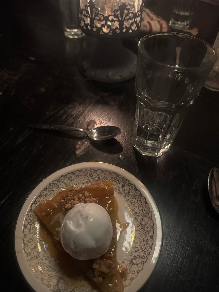 Dimly lit speakeasy dessert with vegan ice cream (pie)