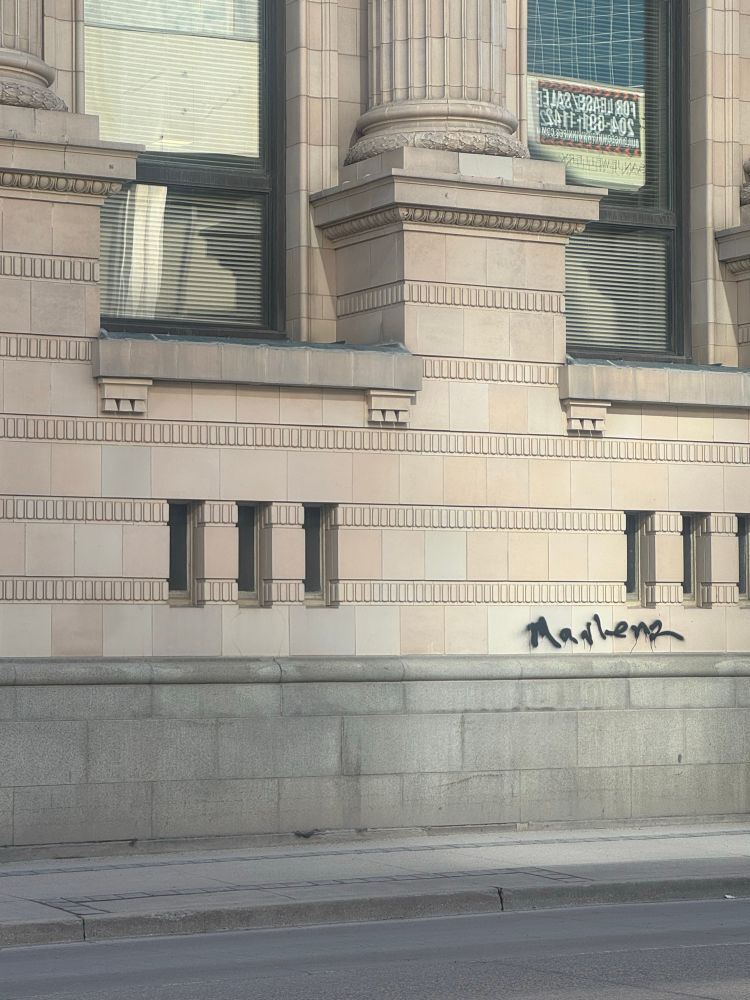 Building with graffiti that says mayhem