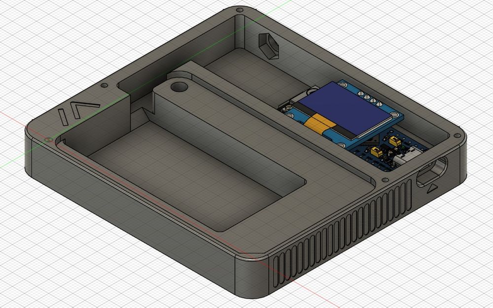 A screenshot of a Fusion 360 CAD model of the Minimesh node, with the keyboard and screen cover removes. The entire model is dark grey, save for the microcontroller and screen mockup, which are in full colour. The Meshtastic "M" logo is embossed on the lower left corner.