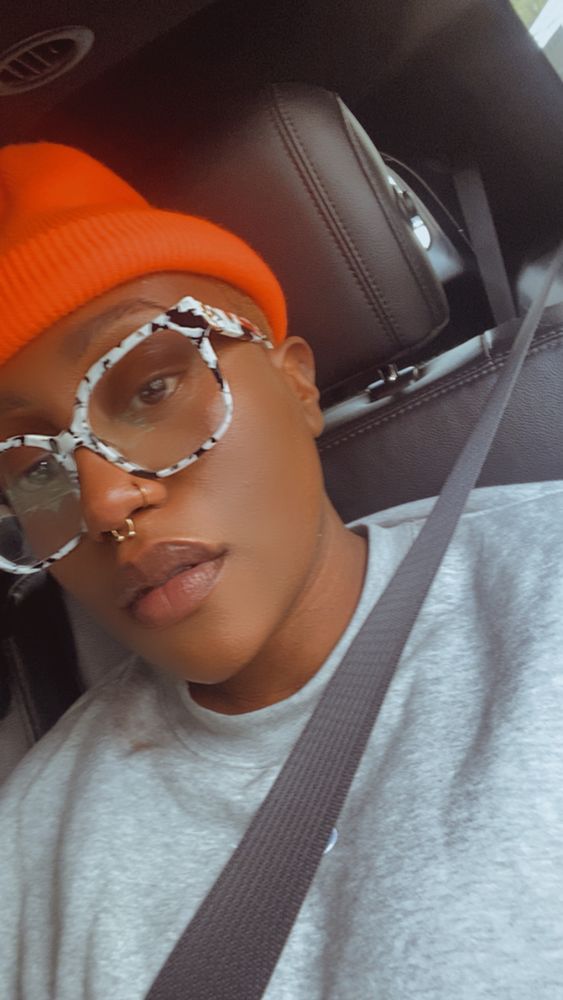 selfie of @terrysburner in a grey hoodie, orange beanie and cow-print glasses 