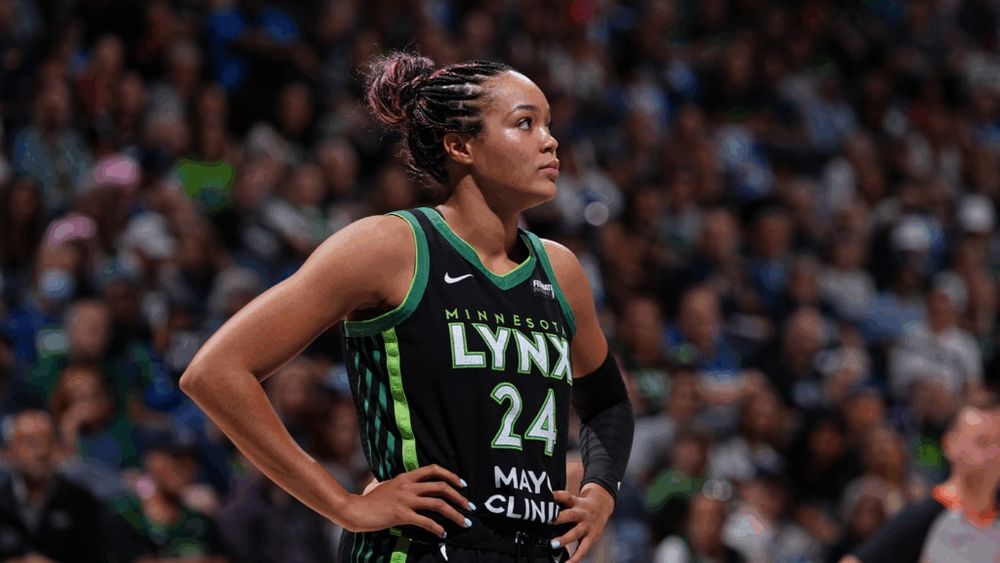 Napheesa Collier in a jersey in front of a crowd