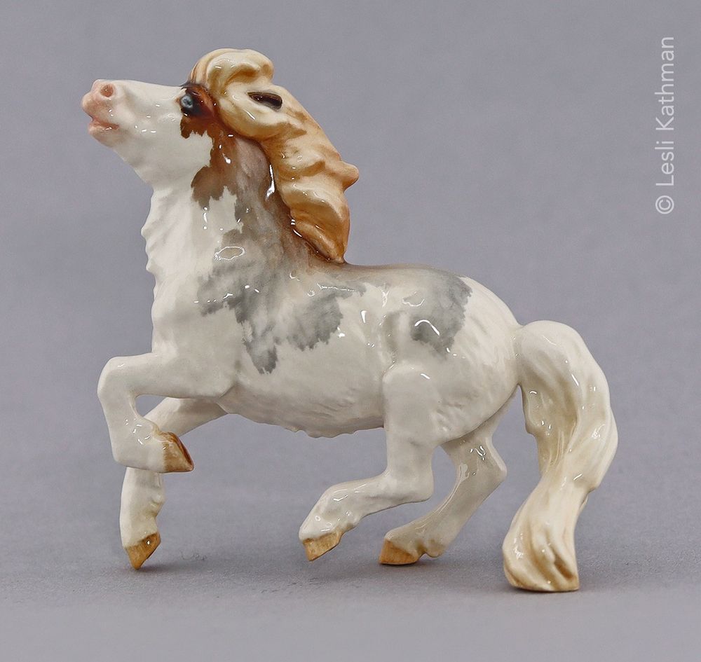 The ceramic version of Sarah Minkiewicz-Breunig's "Popcorn" glazed in dark chestnut roan splashed white. 