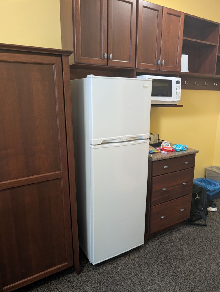 StFX Residence room appliances with fridge, microwave and coffee maker. 