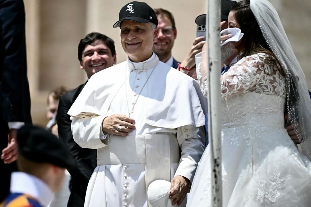 Pope Leo XIV wears a Chicago White Sox baseball cap as he meets newly wedded couples during the weekly general audience in St. Peter’s Square at the Vatican on June 11, 2025. (Filippo Monteforte/Getty-AFP)
