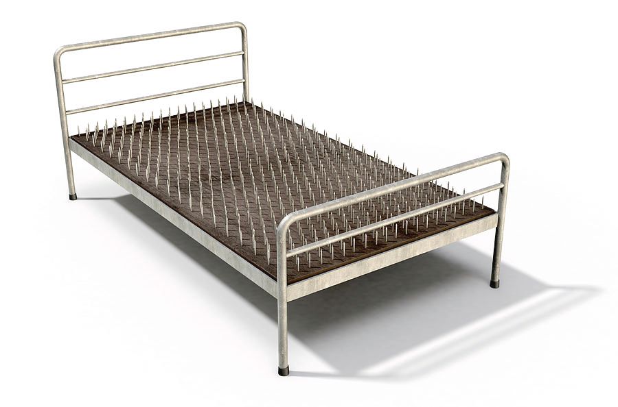 A photograph of a bed of nails