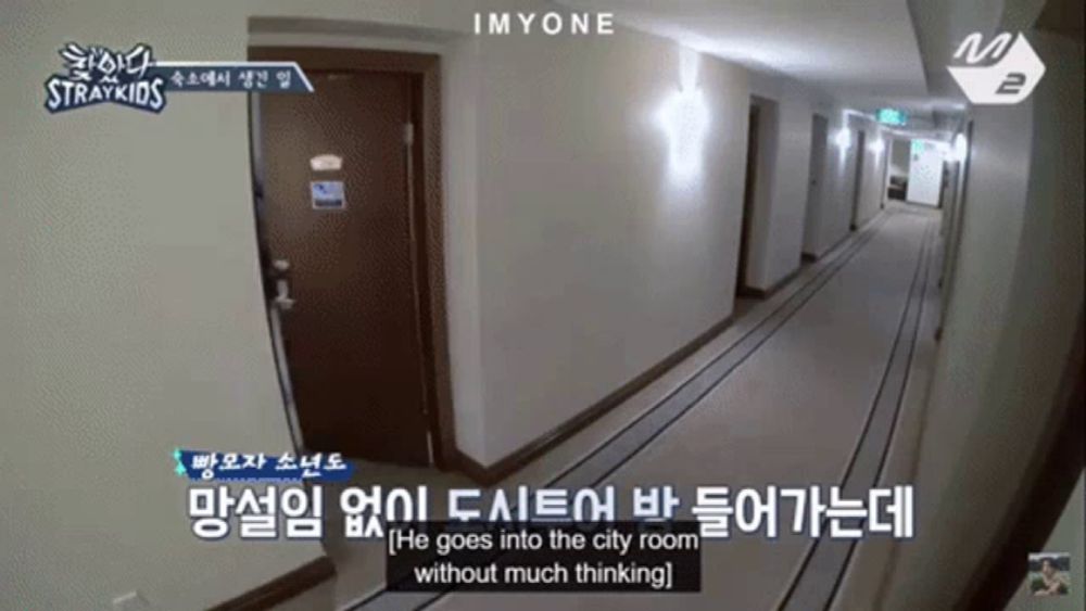 a hallway with a sign that says straykids