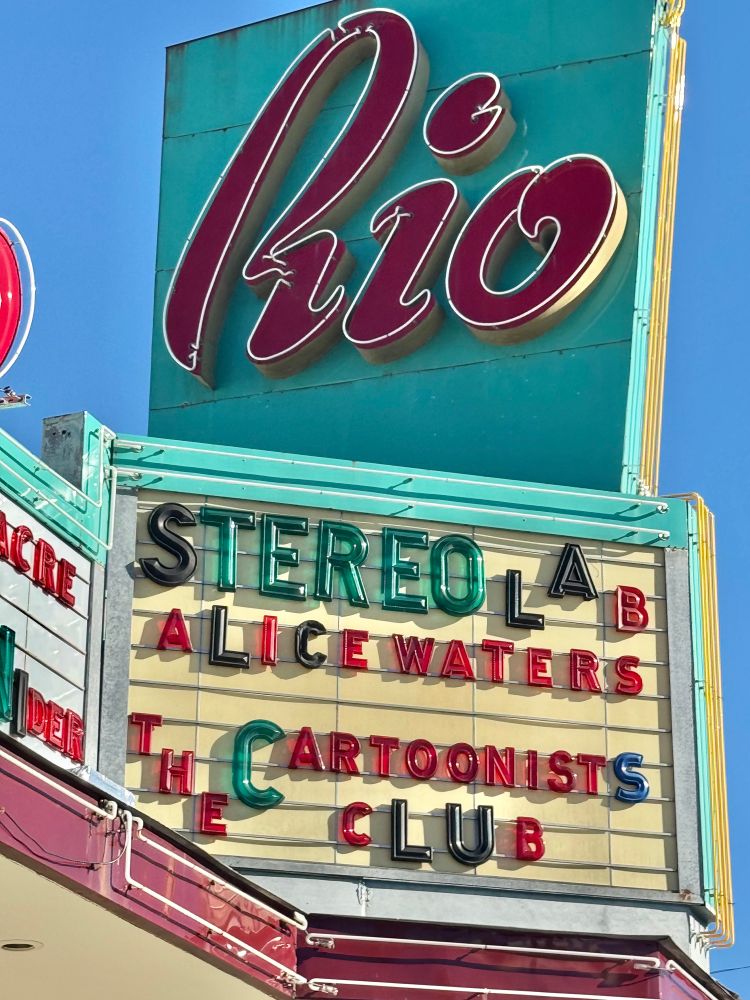 Marquee for the Rio Theater in Santa Cruz,
Listing:
STEREO LAB
ALICE WATERS
CARTOONISTS CLUB