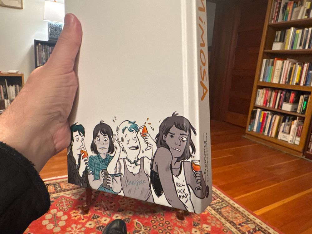 Back cover with same four characters at bottom—this time above the waist.
