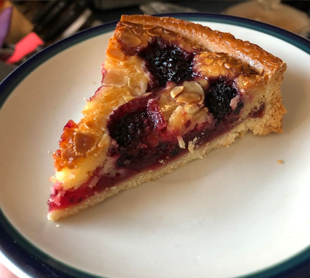 Photograph of a slice of berry tart