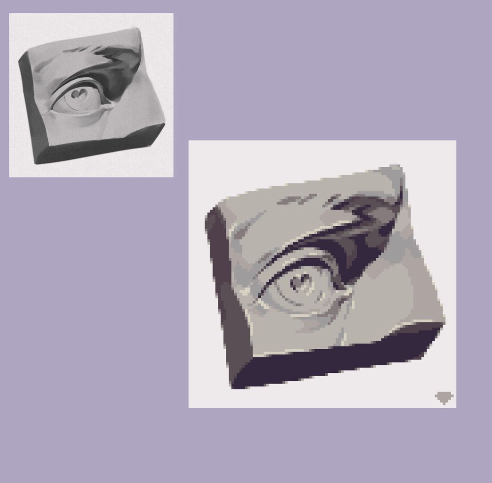 A cutout chunk of a sculpture next to a recreation I did in pixelart. the sculpture mainly focuses on the eye region