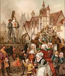 A historical illustration depicting Jacques de Molay, the last Grand Master of the Knights Templar, being burned at the stake in Paris on March 18, 1314. He stands defiantly in his Templar robe, bearing the red cross, as flames rise around him. A crowd of onlookers, including nobles, clergymen, and commoners, watches the execution in front of the gothic architecture of Notre Dame. Some figures appear sorrowful, while others look indifferent or hostile.