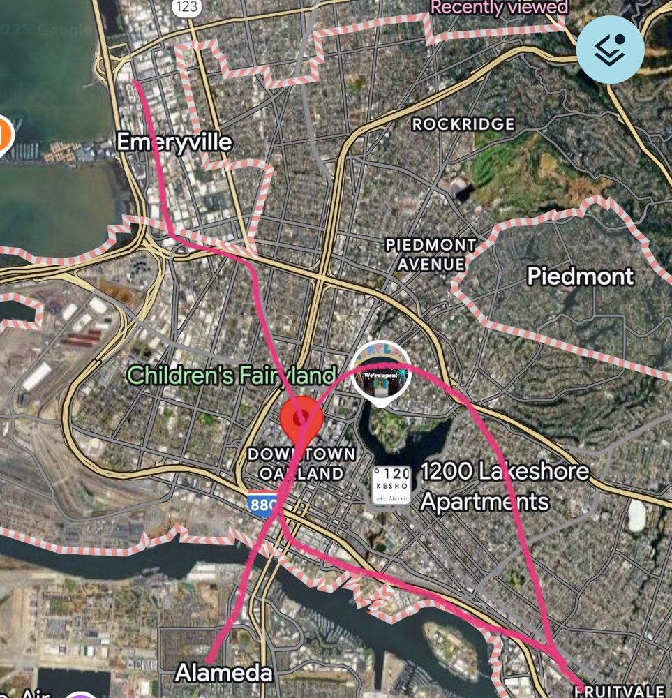 Map of Oakland with poorly drawn pink lines representing proposed routes. One goes north from Alameda parallel to Broadway and splits past downtown with one line following San Pablo to 580 and reconnecting with existing tracks at emeryville. The other branch loops around Lake Merrit to bring the line back to existing tracks near Fruitvale. Another line connects the existing line from Fruitvale to the central Oakland station from the south 