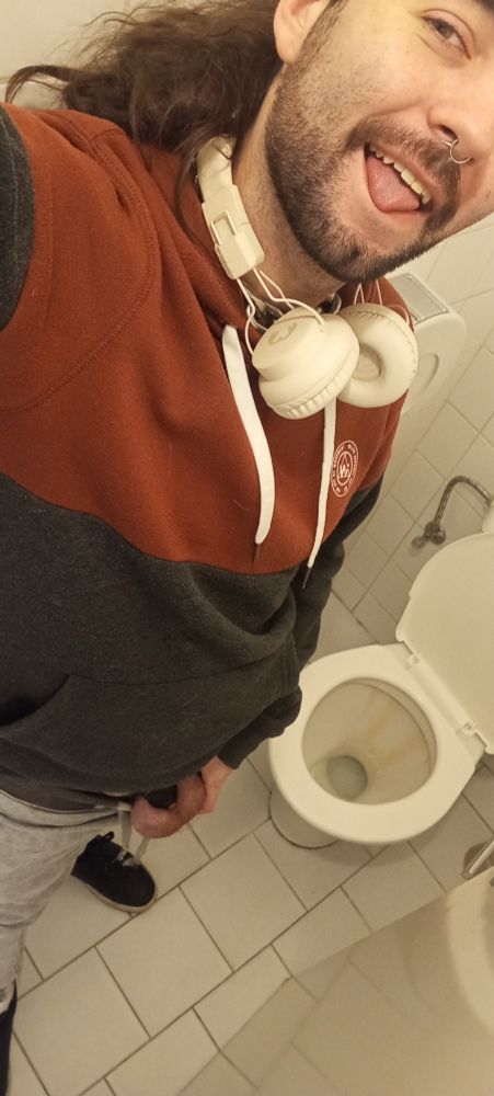 Halfie in a toilet stall doing a cage check