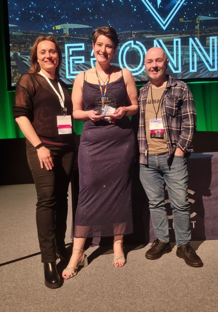 Circle member Jenni Coutts holding her recent BSFA award, flanked by Circle member Neil Williamson and Luna Press editor Francesca Barbini.