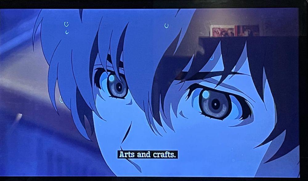 Anime shot with closed caption: “Arts and crafts”